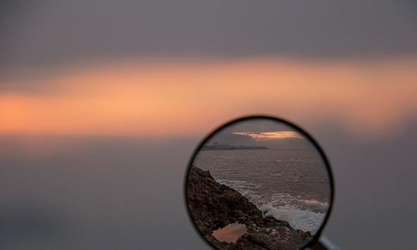 Magnifying glass highlighting the sea